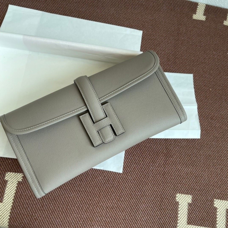H**mes clutch bags